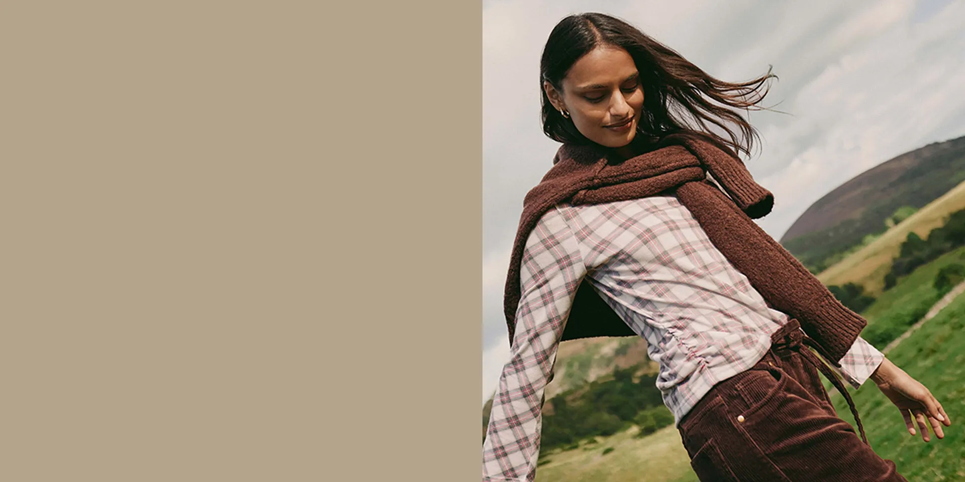 Geruit shirt, bruine trui en corduroy broek.