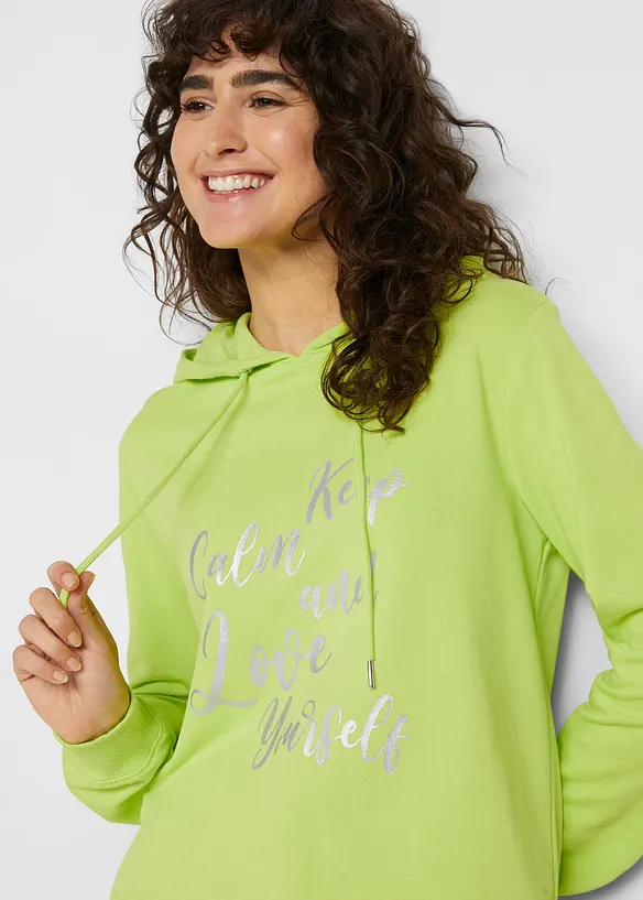 Trendy sweater met statement print en capuchon, bonprix