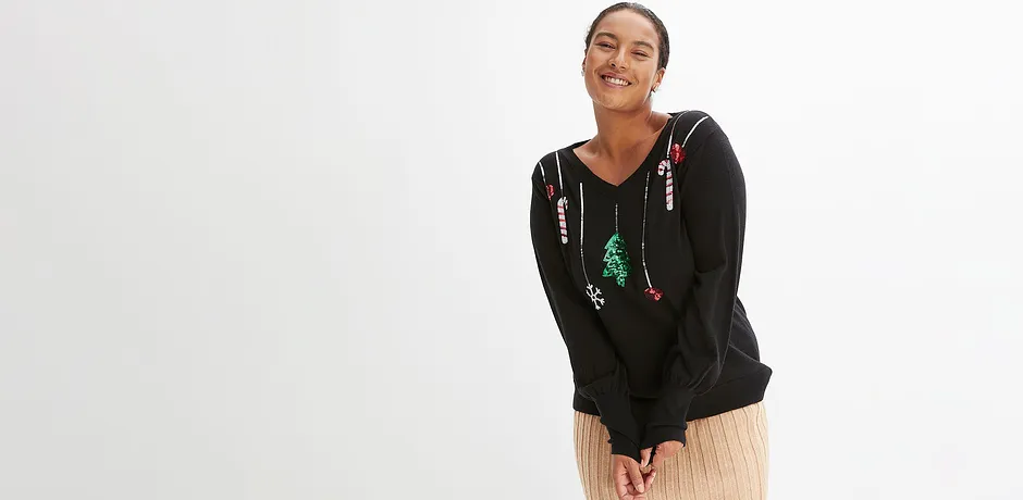 Zwarte trui met kerstmotief.