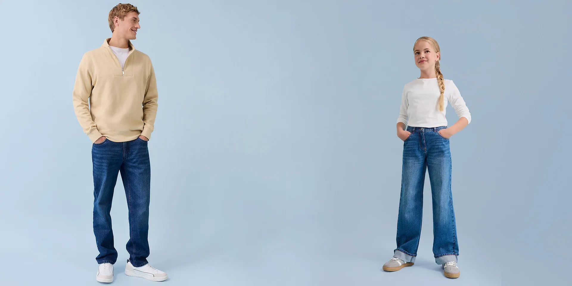Casual Fashion: man in een sweatshirt en meisje in een longsleeve met spijkerbroek voor een lichte achtergrond.