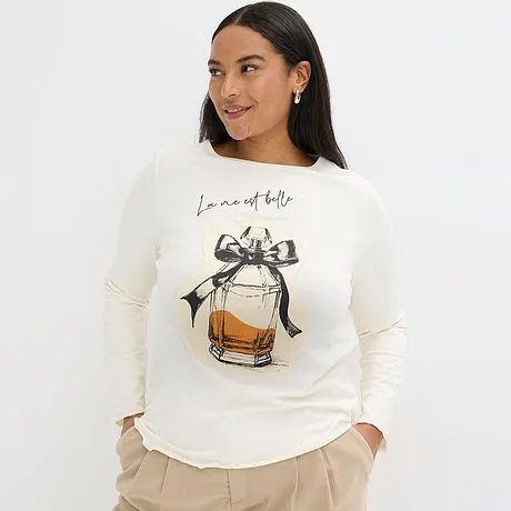 Crèmekleurige longsleeve met parfumflesmotief en strik.
