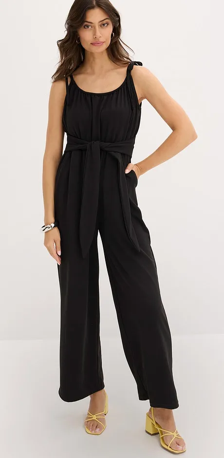 Elegante zwarte jumpsuit met bandjes en wijde pijpen.