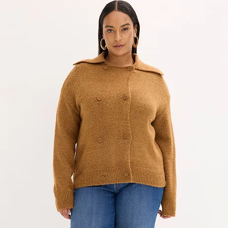 Bruin gebreid vest met knopen en kraag, gecombineerd met blauwe jeans.