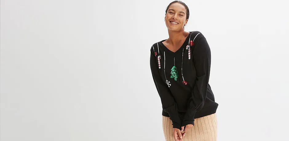 Zwarte trui met kerstmotief.