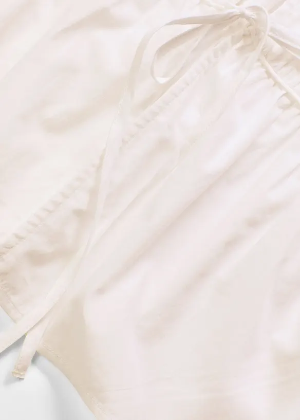 Mouwloze blouse met volants en strikjes, bonprix